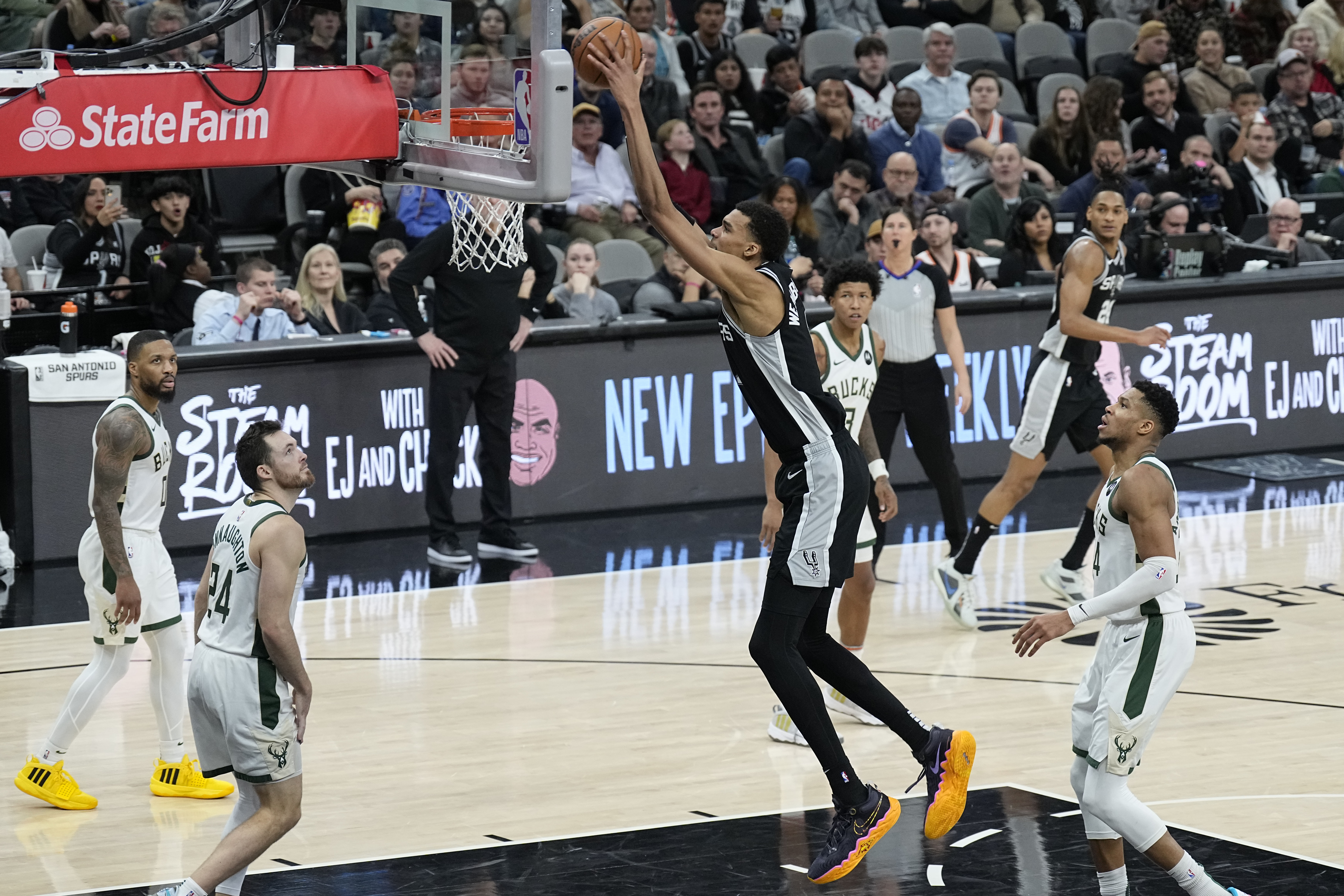 Jan 4, 2024; San Antonio, Texas, USA; San Antonio Spurs forward Victor Wembanyama (1) dunks during the second half against the Milwaukee Bucks at Frost Bank Center.